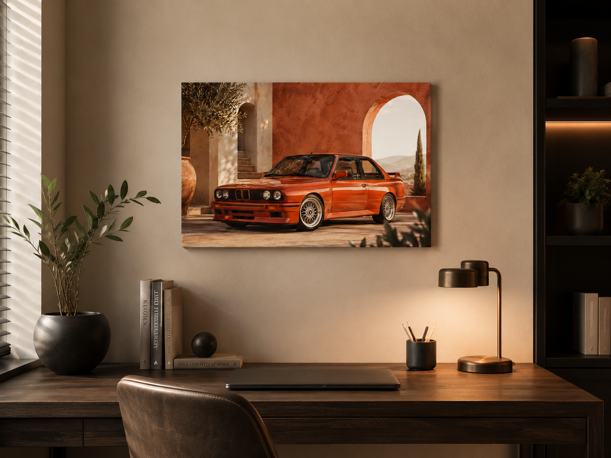 Rosso M3 classic red car canvas displayed above a wooden desk in a refined home office