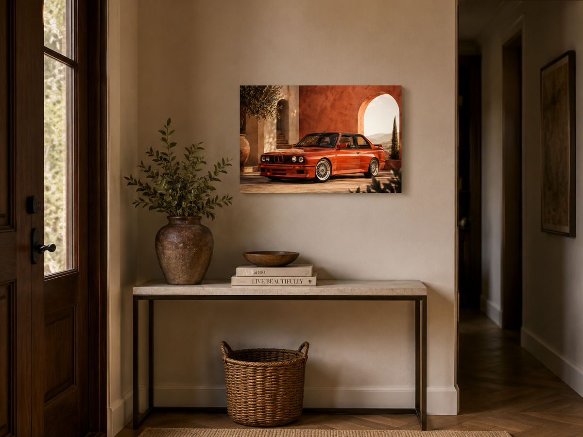 Rosso M3 red performance coupe canvas above a slim console table in a modern hallway