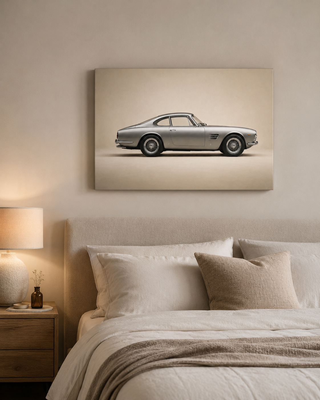 Silver classic car wall art displayed above a neutral modern bed