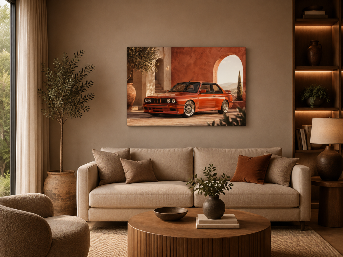 Rosso M3 automotive wall art above a cream sofa in a warm contemporary living room