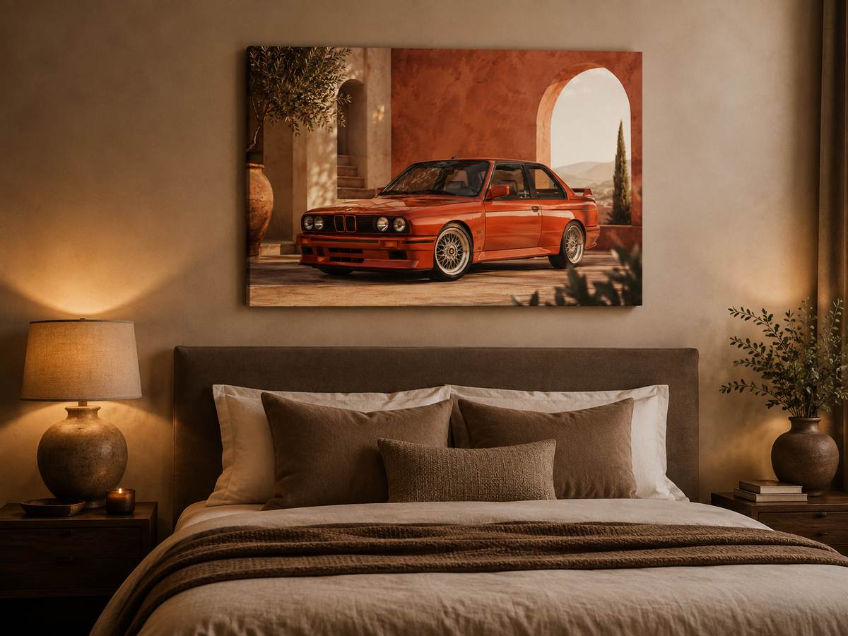 Rosso M3 red classic coupe canvas displayed above a bed in a cozy neutral bedroom