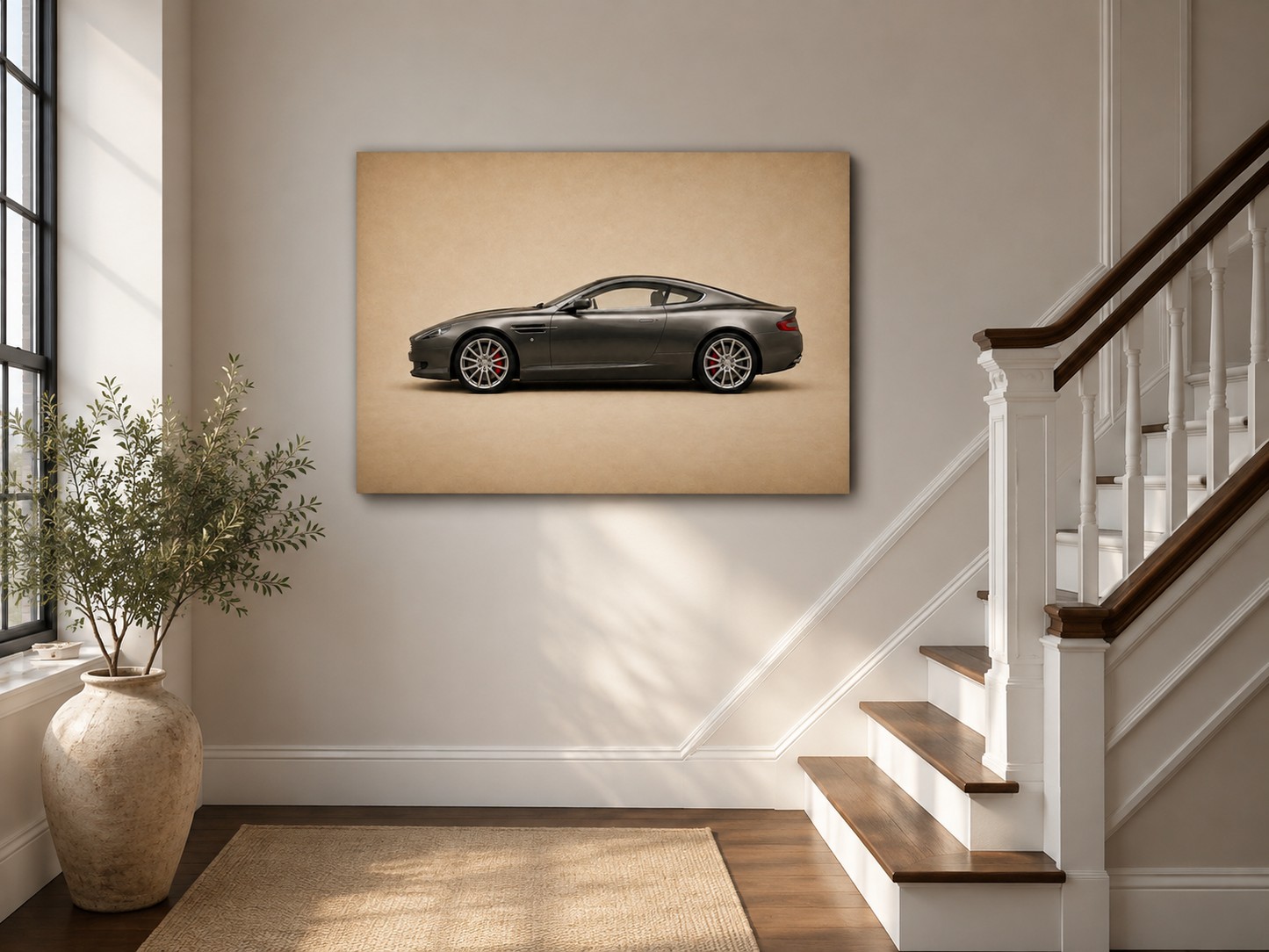 Graphite Grand Tour graphite automotive wall art displayed beside a bright staircase